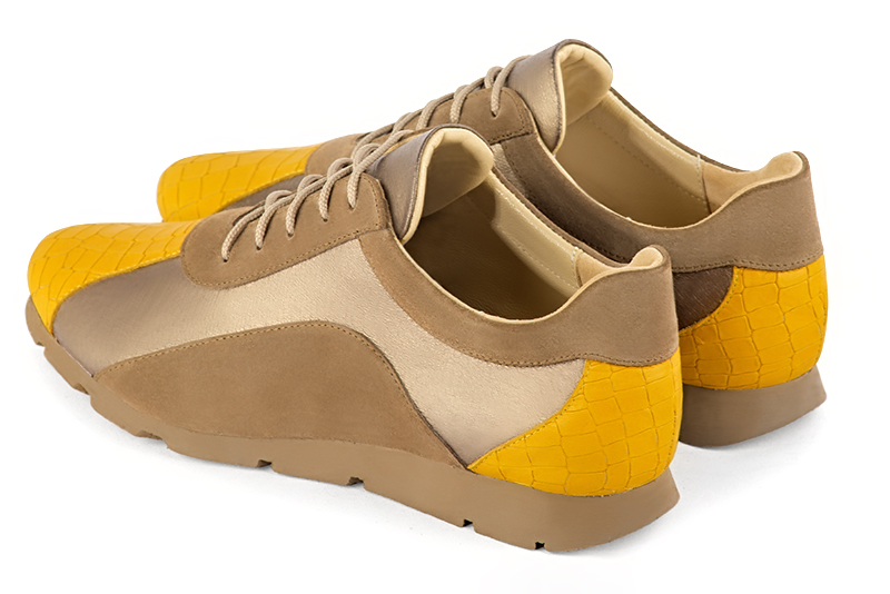 Mustard yellow, bronze gold and chocolate brown women's two-tone elegant sneakers. Round toe. Flat rubber soles. Rear view - Florence KOOIJMAN